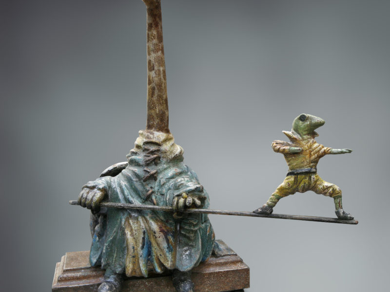 Giraffe met balancerende kikker